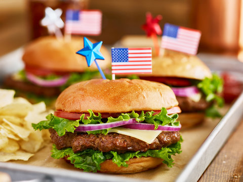 burgers and potato chips with american flags patriotic theme