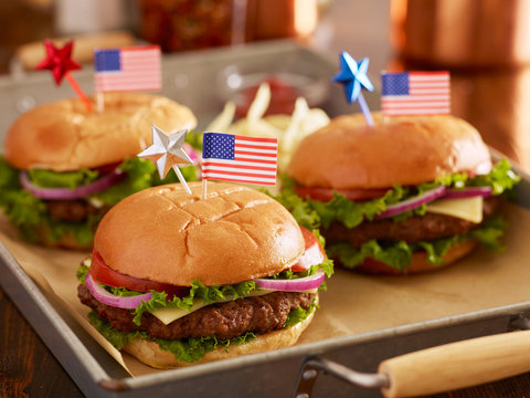 4th of july themed cheeseburgers witth american flags