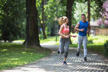 Young couple jogging at the park.