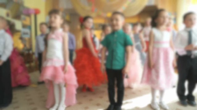 Children dancing, singing songs at a kindergarten