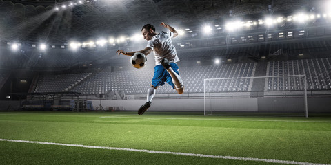Soccer player hitting ball