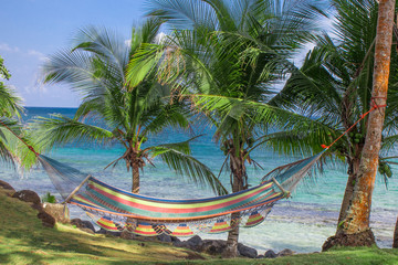 Fototapeta na wymiar tropical beach with hammock on palm, relax concept from Nicaragua