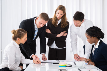 Businesspeople Analyzing Graph