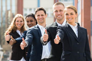 Businesspeople Showing Thumb Up Sign