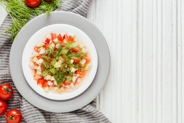 Salad of cucumber, tomato, dill and olive oil