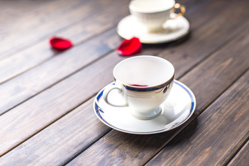 two elegant coffee cups on wood table
