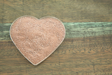 Cocoa powder in bowl - Heart