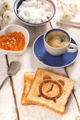 Breakfast, coffee and toast with a alarm clock pattern 