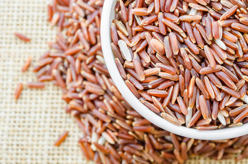 Red rice in white bowl.