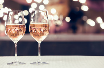 A pair of white wine glasses on an isolated background