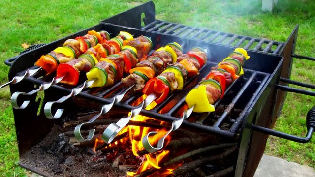 Barbecue. Shish kebab with grilled peppers on hot grill

