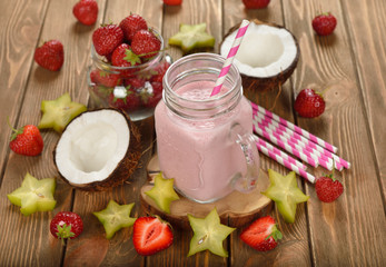 Refreshing cocktail with coconut milk and strawberries