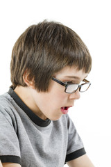 young boy in grey t-shirt with laptop