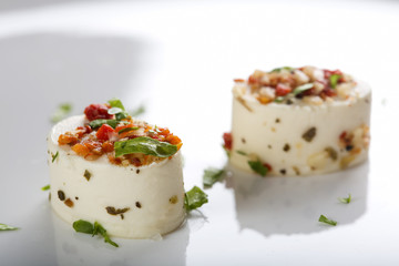 Appetizers with cheese and various ingredients