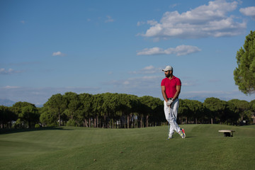 handsome middle eastern golf player portrait at course