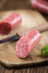 German Mettwurst on wooden background