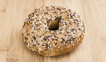 Wooden table with fresh baked wholemeal Bagels