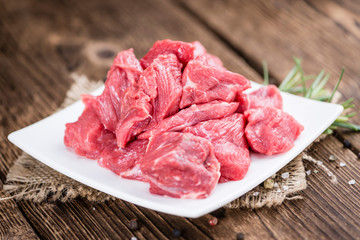 Beef Fillet (chopped) on wooden background