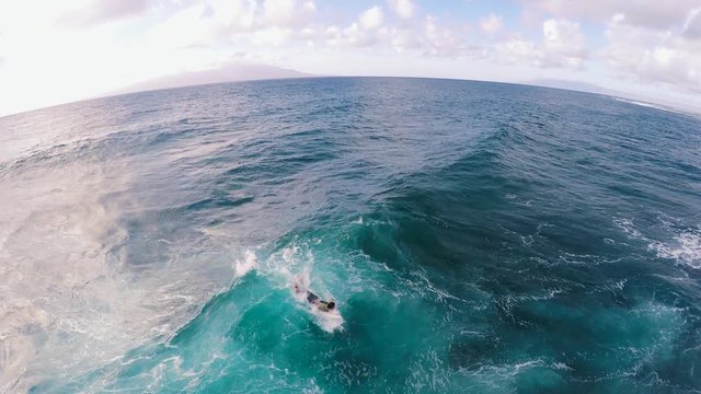 A Surfer Catches a Wave in a Dramatic Fashion With Aerial Followcam