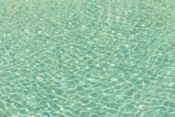 Green swimming pool rippled water detail