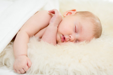 adorable baby sleeping on stomach
