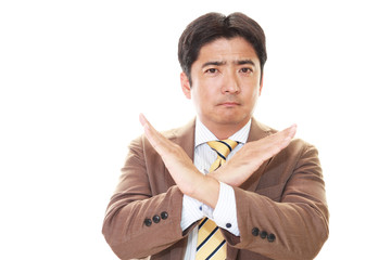 禁止の意思表示をするビジネスマン