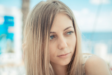 Portrait of elegant woman sitting in cafe outdoors