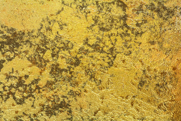 Abstract background texture of stone wall in yellow gold tone. Grunge wall. Cement wall texture and background with copy space for text or image.