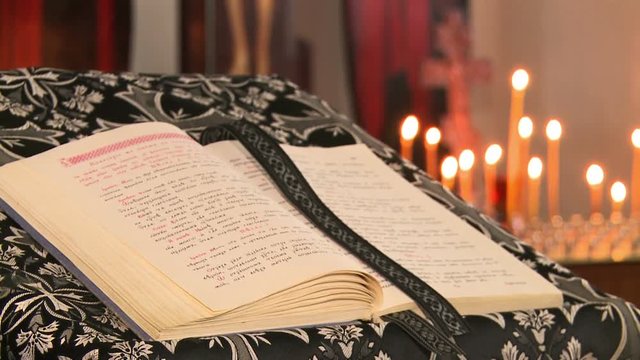 The Bible in expanded form, against the Church of candles in the Orthodox Church.