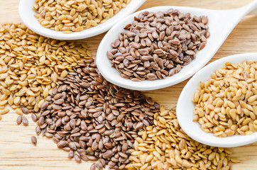 Brown and gold linseeds or flaxseeds.