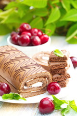 Roll with chocolate, sweet cream and cherries