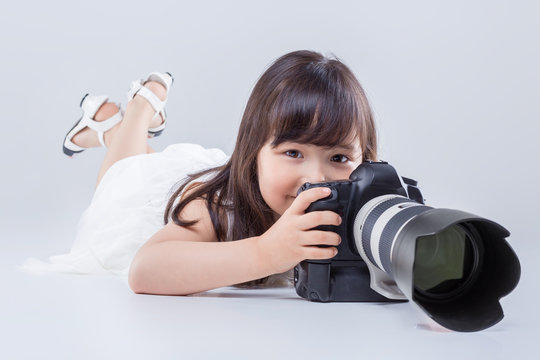 little girl with  camera