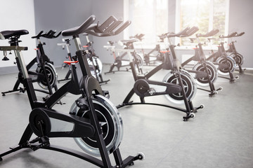 Healthy lifestyle concept. Spinning class with empty bikes