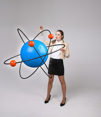 Woman scientist with atom model, research concept