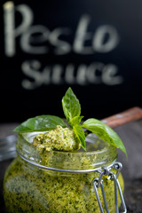 Green pesto sauce with a basil
