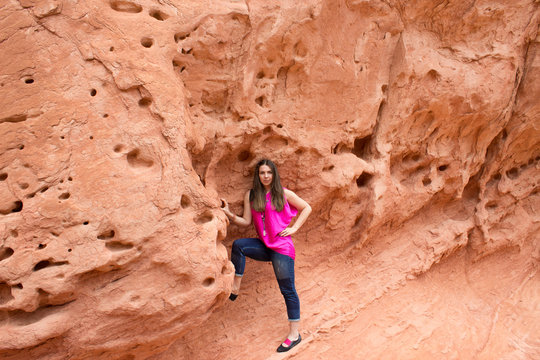 The young woman posing at Valley of Fire State Park, USA.