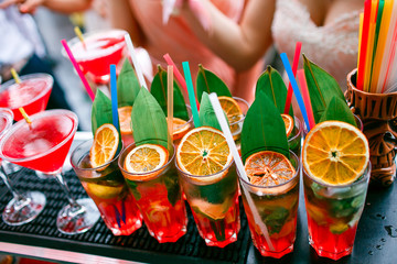 Colorful cocktails close up. an open-air party. after the rain