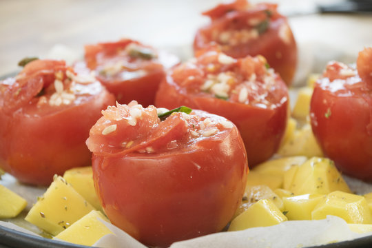 tomatoes stuffed with rice and served with potatoes