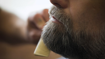 Stylish hair salon, barber Empozantny engaged beard respectable businessman.