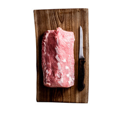 big piece of raw meat on cutting board isolated on a white background