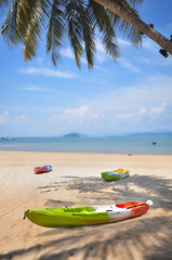 Kayak boat on tropical beach background, happy summer holiday concept