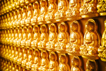 The statue of Buddha in Chinese temple wall in Thailand