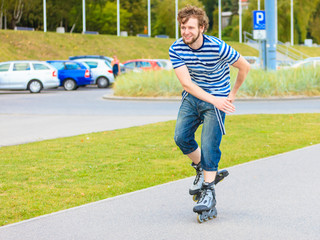 Young man rollerblading outdoor on sunny day