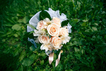 Wedding bouquet from peach-colored roses