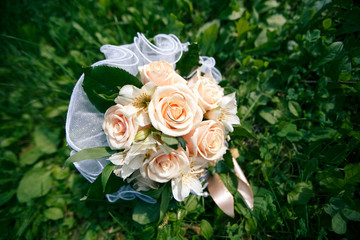 Wedding bouquet from peach-colored roses
