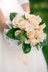 Wedding bouquet from peach-colored roses