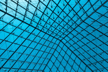 Abstract modern glass ceiling, blue toned