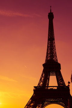 Eiffel Tower silhouette at sunset in Paris France