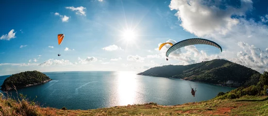 Tuinposter Paraglider flying over the water © Dudarev Mikhail