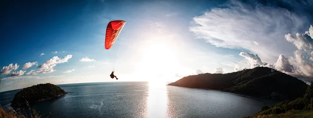 Fototapeten Paraglider flying over the water © Dudarev Mikhail